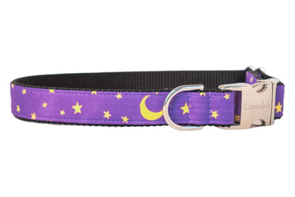 Purple dog collar with a night sky design featuring bright stars and crescent moons, paired with polished hardware and a sleek nylon webbing lining. This dreamy, magical accessory is perfect for dogs celebrating Halloween or just looking stylish under the moonlight.
