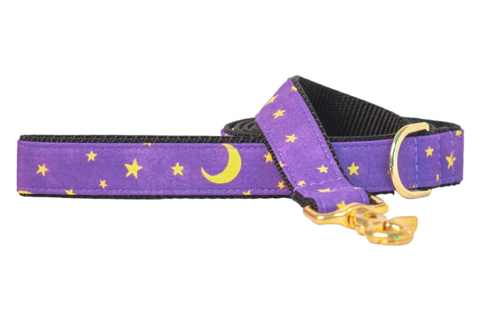 Celestial-themed purple dog leash with  stars and crescent moons, backed with nylon webbing and finished with metal hardware. Perfect for Halloween walks, the design adds a magical, spooky-season vibe without being over-the-top.