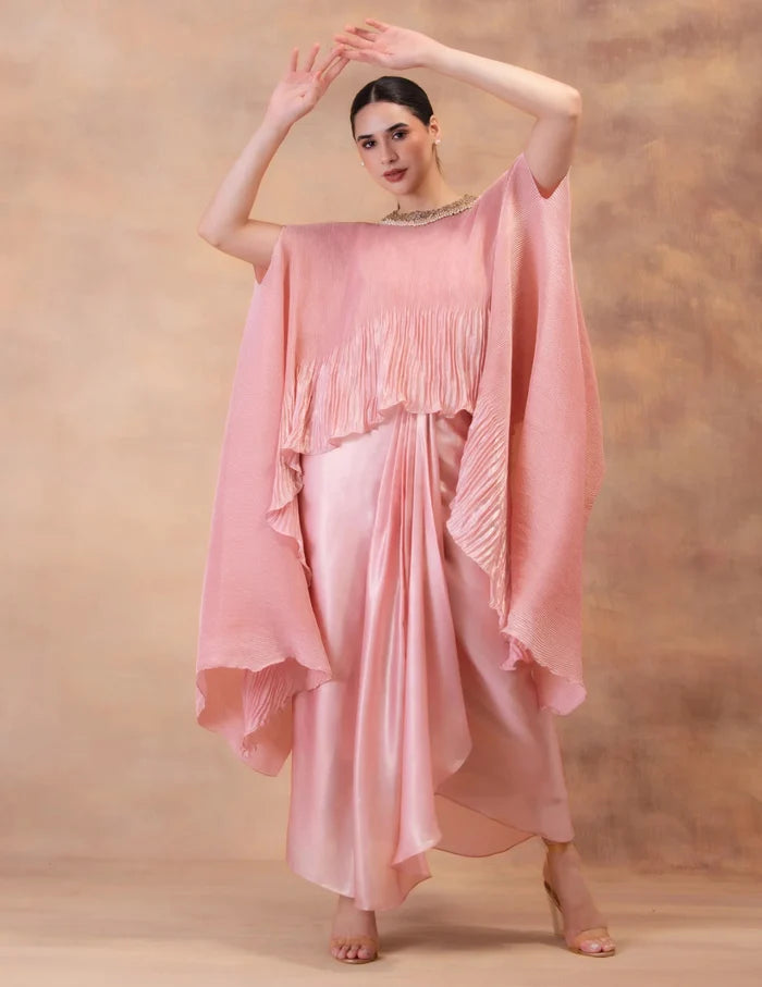 Model wearing the 'BLUSH PINK' kaftan and dhoti set in Singapore, crafted in micro-pleated georgette satin with intricate hand embroidery.