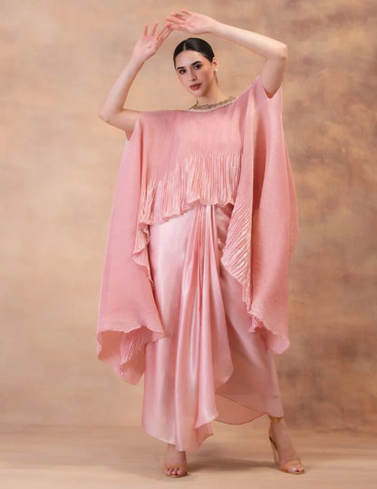 Model wearing the 'BLUSH PINK' kaftan and dhoti set in Singapore, crafted in micro-pleated georgette satin with intricate hand embroidery.