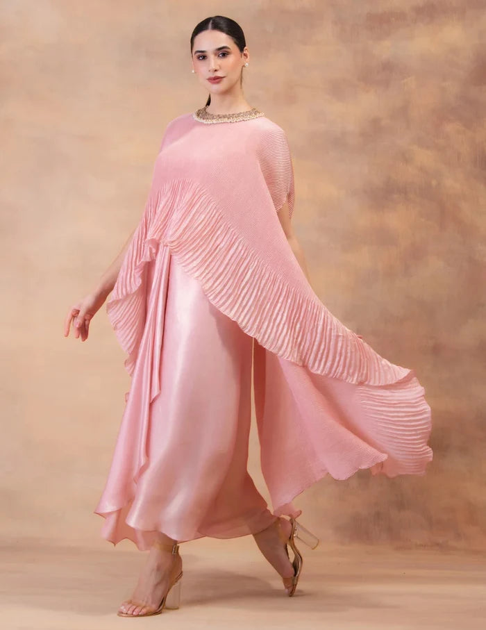 Model wearing the 'BLUSH PINK' kaftan and dhoti set in Singapore, crafted in micro-pleated georgette satin with intricate hand embroidery.