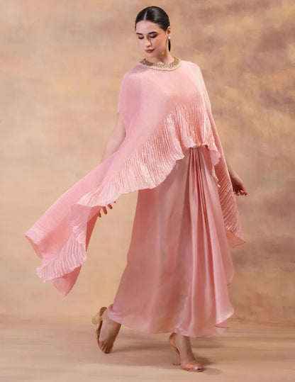 Model wearing the 'BLUSH PINK' kaftan and dhoti set in Singapore, crafted in micro-pleated georgette satin with intricate hand embroidery.