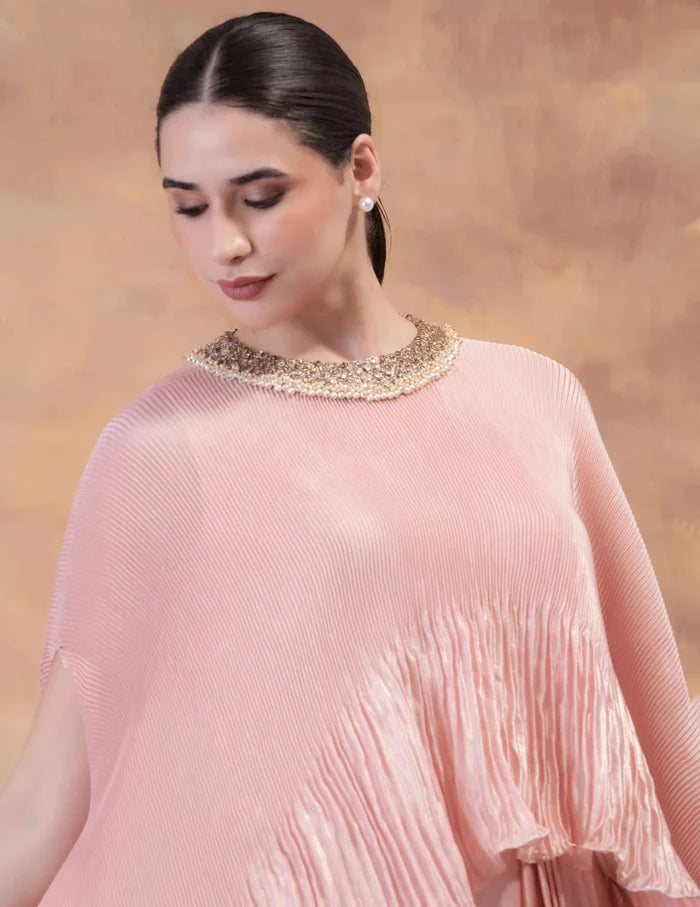 Model wearing the 'BLUSH PINK' kaftan and dhoti set in Singapore, crafted in micro-pleated georgette satin with intricate hand embroidery.