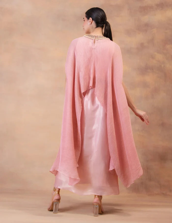 Model wearing the 'BLUSH PINK' kaftan and dhoti set in Singapore, crafted in micro-pleated georgette satin with intricate hand embroidery.