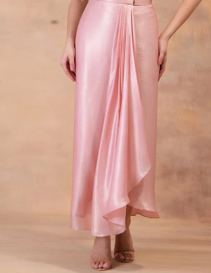 Model wearing the 'BLUSH PINK' kaftan and dhoti set in Singapore, crafted in micro-pleated georgette satin with intricate hand embroidery.