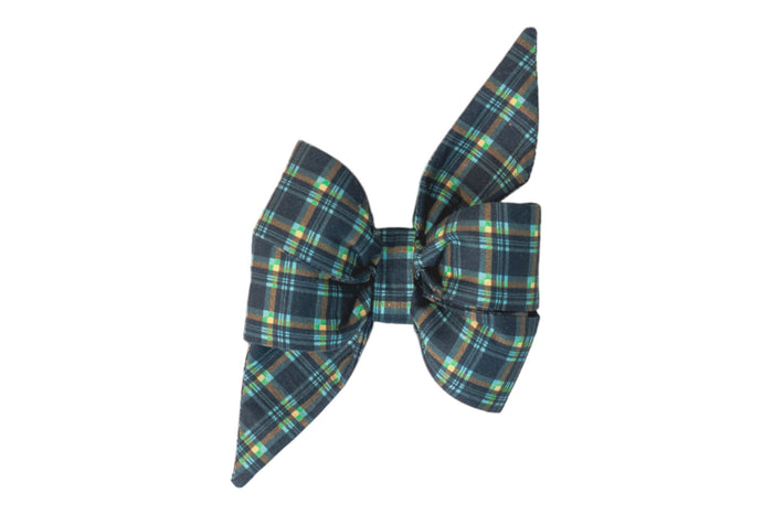 Large feminine dog belle bow in a dark navy plaid pattern with light accents, featuring pointed tails for an elegant finish.