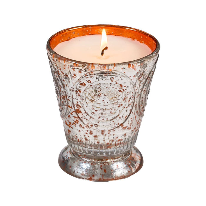 Fleur de Lys Tangerine Tumbler Hand-Poured Soy Scented Candle in a textured, footed glass holder with a distressed silver and copper-orange finish, set against a plain white background.
