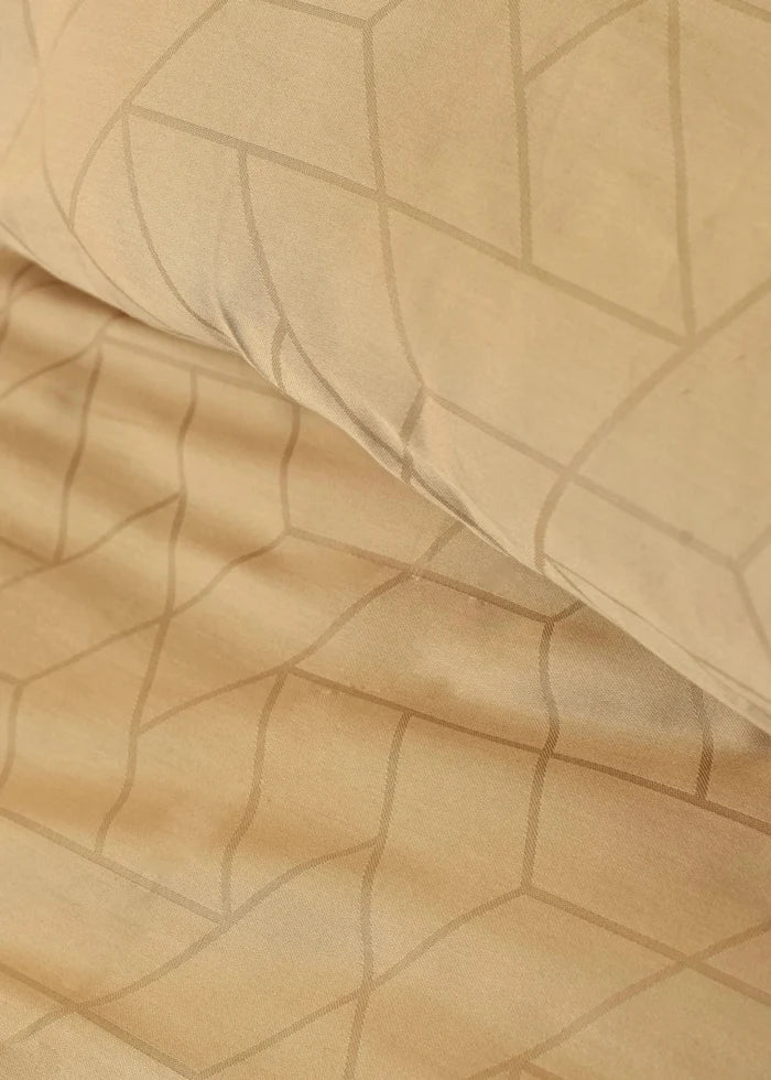 Butter cotton sateen duvet cover fabric close-up with geometric embossed pattern