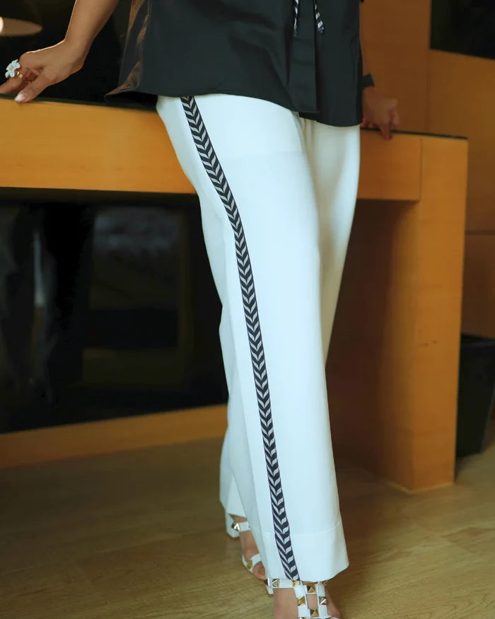 Black Bemberg Silk Co-Ord Set featuring a sculpted floral tie-detail shirt paired with ivory straight-fit pants for an elegant and contemporary look.