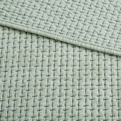 Pick-Stitch Artisan Quilted Throw featuring a textured, quilted cotton slub surface with soft pick-stitch detailing.