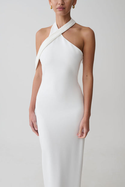 Woman wearing white crossover neck dress.