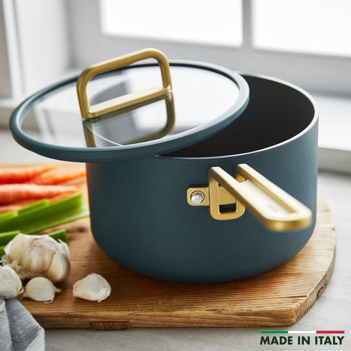 Venetian teal ceramic 4-quart saucepan with gold handle and lid.