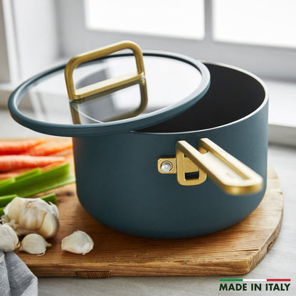 Venetian teal ceramic 4-quart saucepan with gold handle and lid.