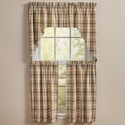 A set of beige green and brown Toffee & Elm Plaid Cafe Tiers and Swags, including a top panel and two tier panels, styled on a window against a neutral beige wall.