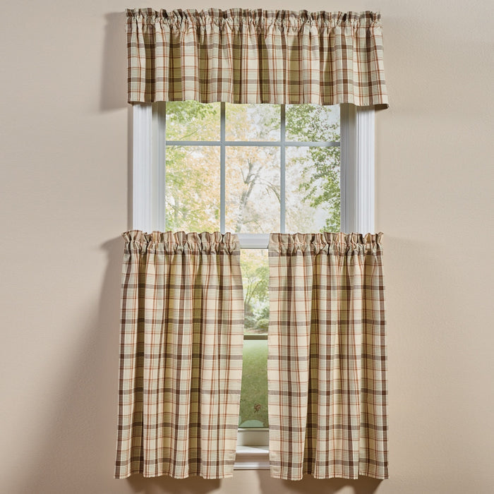 Toffee & Elm Plaid Cafe Tiers and Valance in a beige green and brown plaid pattern, styled on a window against a beige wall.