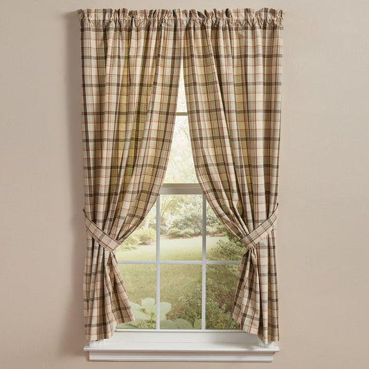 Toffee & Elm Plaid Short Panel Curtains 63" with a gathered top rod pocket, tied back on either side of a white window to reveal a garden view outside.