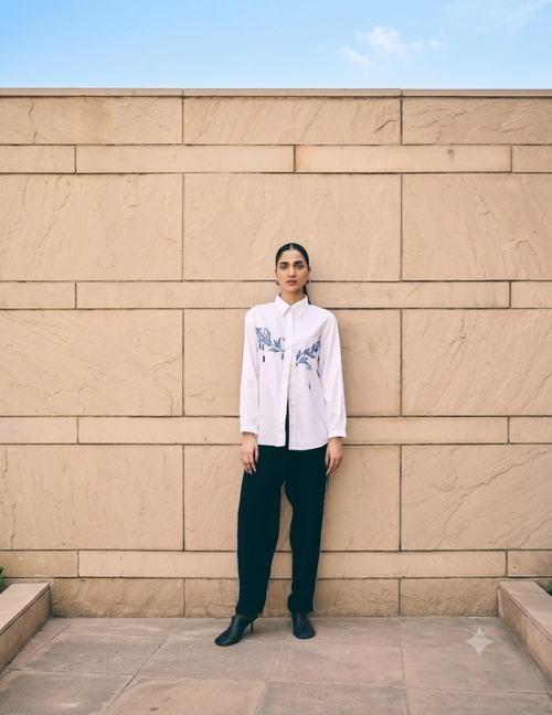 White Leaf Hue Embroidered Co-Ord Set featuring intricate blue floral embroidery on a premium cotton shirt paired with relaxed-fit tailored pants for an elegant contemporary look.