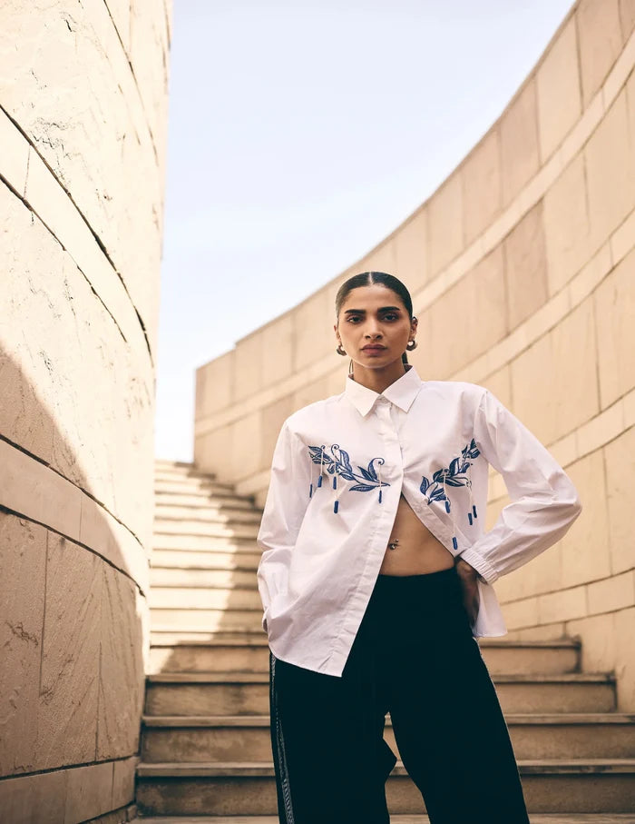 White Leaf Hue Embroidered Co-Ord Set featuring intricate blue floral embroidery on a premium cotton shirt paired with relaxed-fit tailored pants for an elegant contemporary look.